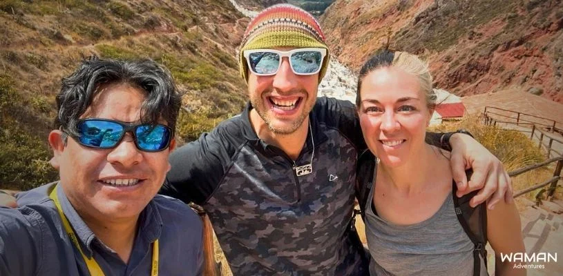 Tour guide from Waman Adventures with their travelers at Salineras