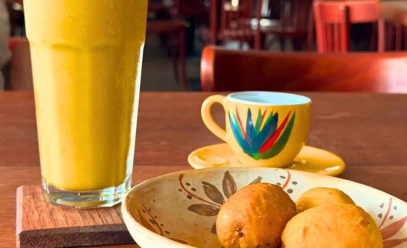 Glass of aguajina made from aguaje fruit in the Peruvian Amazon