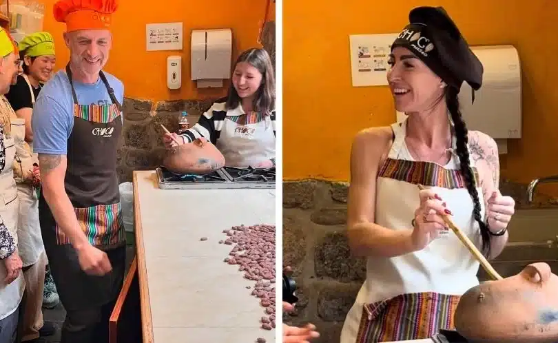 Visitors at ChocoMuseo in Cusco participating in a chocolate-making workshop, learning to roast cacao beans and create handmade bars inside a bright, cozy artisan kitchen.