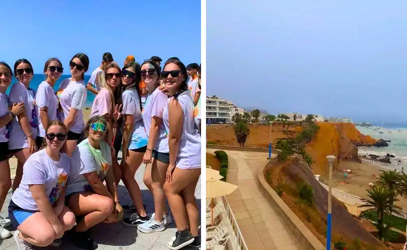 Families and tourists enjoy a sunny day at Santa María del Mar Beach, Peru, relaxing on the sand with colorful umbrellas, calm ocean waters, and a bright blue sky.