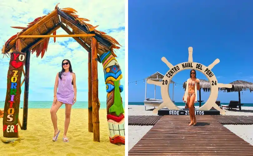 Colorful Zorritos beach sign with two tourists posing for photos beside palm trees and bright sand; clear sky, turquoise sea, and sunny atmosphere on Peru’s northern coast.