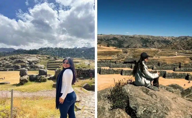 Two women explore the stone ruins and ceremonial fountains of Sacsayhuamán near Cusco, surrounded by Andean landscapes and cloudy blue skies.