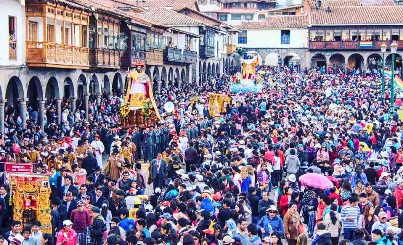 Religious dancers accompany colorful saint processions through Cusco’s historic streets during Corpus Christi, showcasing faith and Andean cultural heritage.
