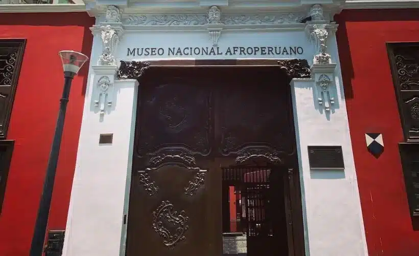 Visitors exploring the Afro-Peruvian Museum in Lima, viewing exhibits on music, dance, and history that highlight the Afro-Peruvian community’s cultural contributions.