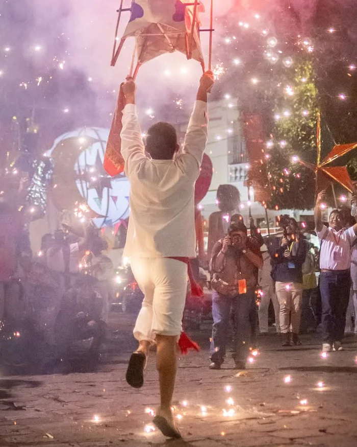Musicians perform lively traditional rhythms while dancers in colorful costumes celebrate outdoors, filling the area with energy, movement, and cultural expression during a festival.