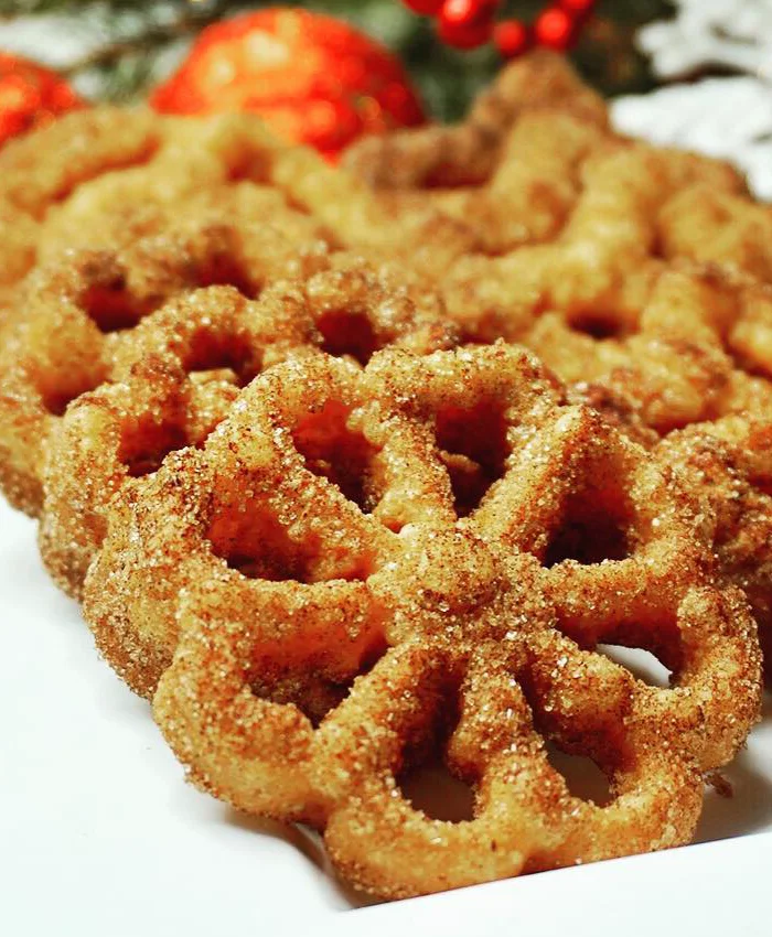 En la imagen se aprecian deliciosas rosetas espolvoreadas con azúcar.