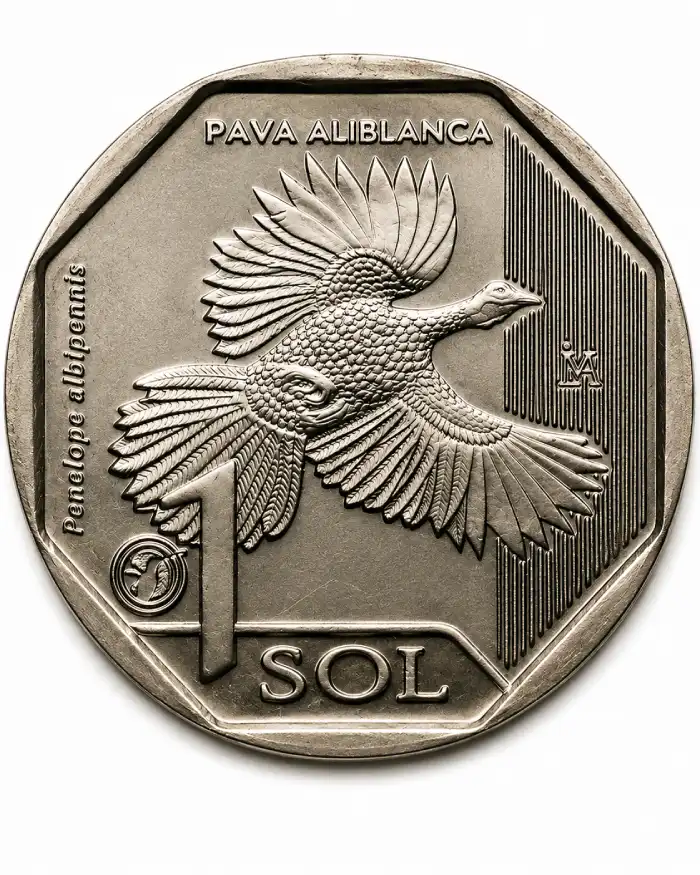 Moneda peruana de un sol con la pava aliblanca grabada