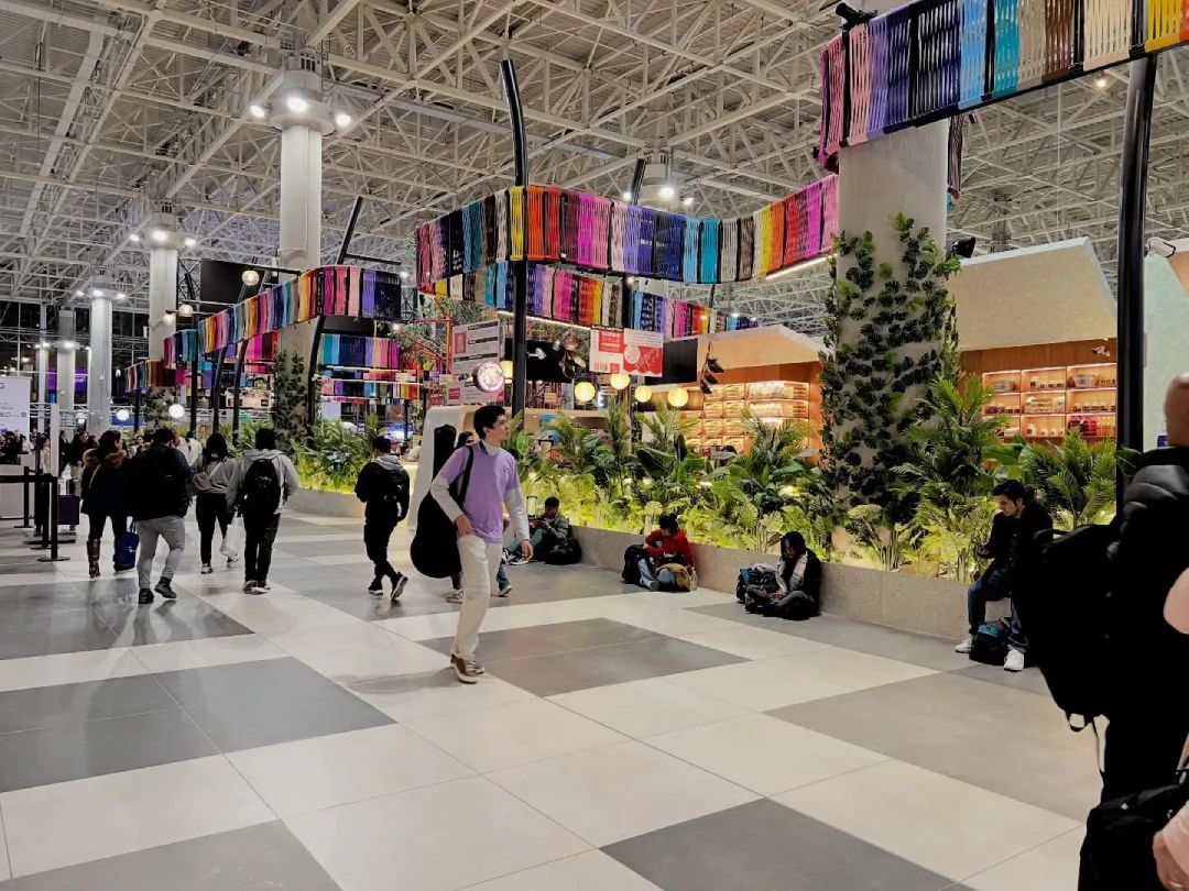 Passengers inside Jorge Chávez Airport with shops and Peruvian decorative elements